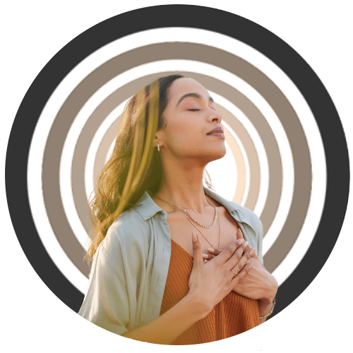 Woman with eyes closed holding her hands on her chest, indicating peace, over neutral concentric circles